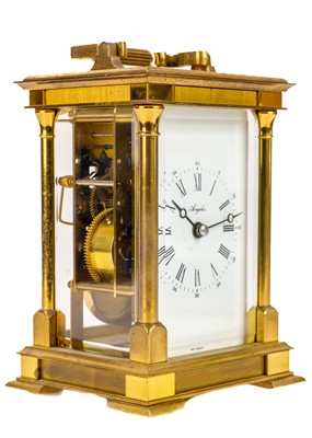 Lot 564 - An Angelus brass carriage clock.