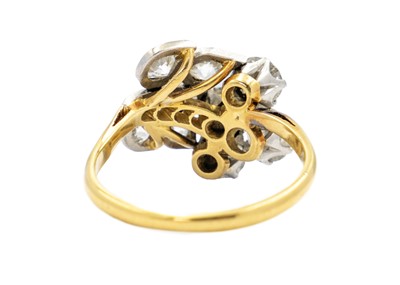 Lot 228 - An exquisite Art Deco 18ct gold and platinum diamond set floral design ring.