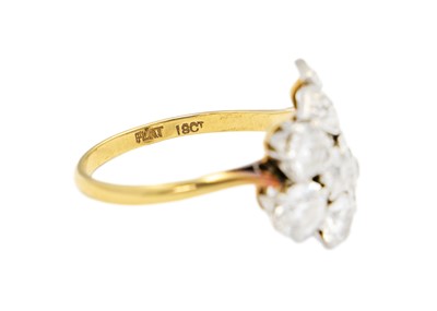 Lot 228 - An exquisite Art Deco 18ct gold and platinum diamond set floral design ring.