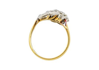 Lot 228 - An exquisite Art Deco 18ct gold and platinum diamond set floral design ring.