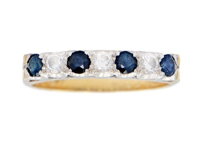 Lot 93 - An 18ct diamond and sapphire seven-stone half hoop ring.