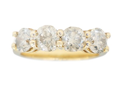 Lot 100 - An 18ct diamond set four stone ring