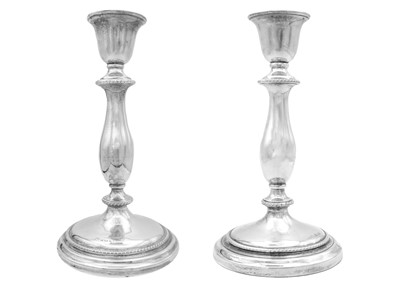 Lot 26 - A pair of silver baluster candlesticks by Charles S Green & Co Ltd.