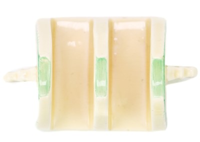 Lot 384 - A Clarice Cliff Tartan (green) pattern daffodil shape toast rack.
