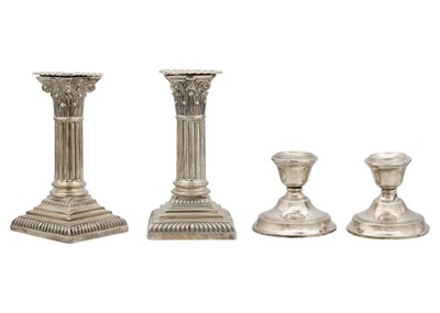 Lot 30 - A Victorian silver pair of squat Corinthian column candlesticks by Hawksworth, Eyre & Co Ltd.