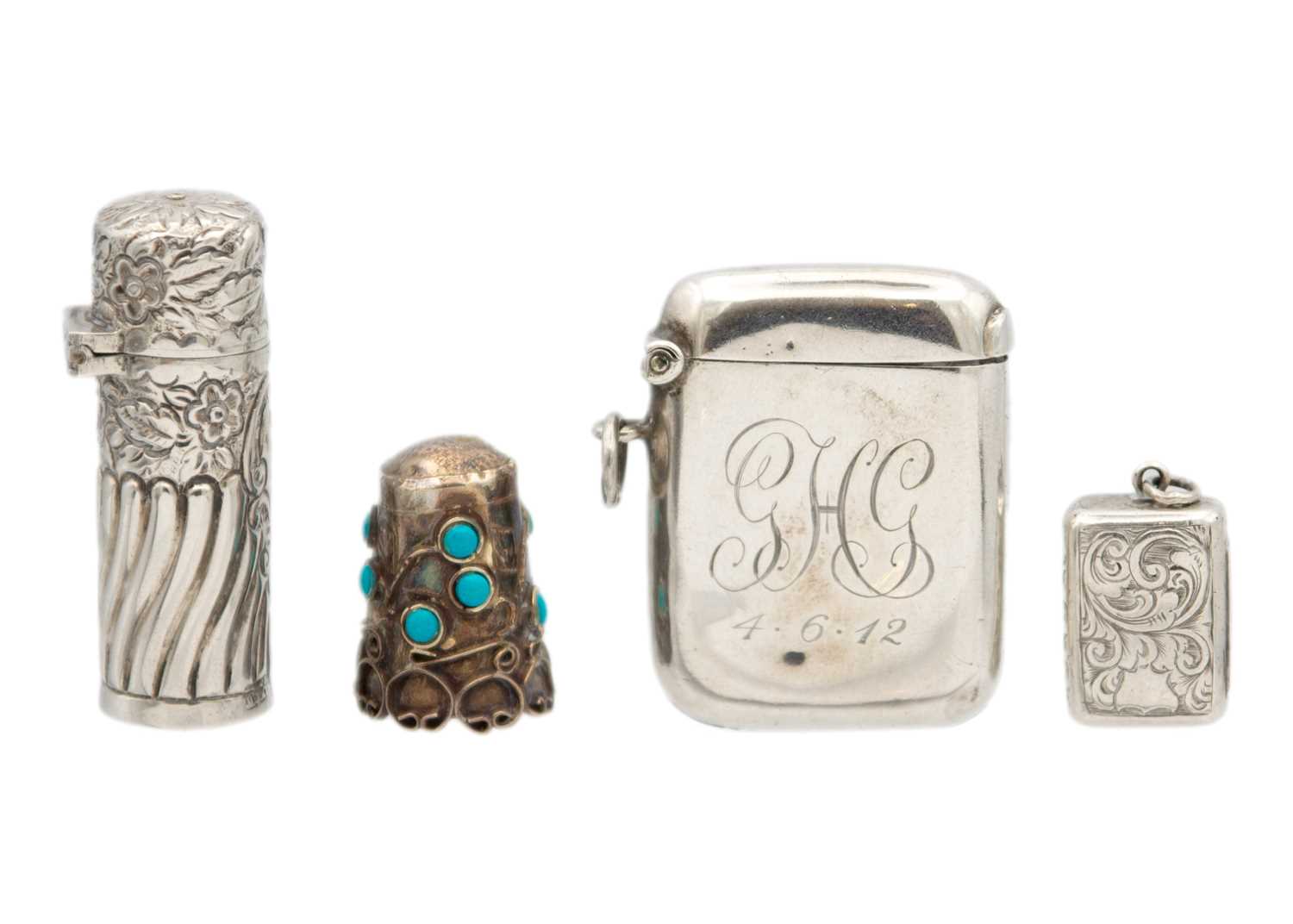 Lot 228 - A selection of four small silver items,