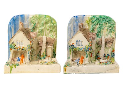 Lot 397 - A pair of Clarice Cliff cottage bookends shape 411.