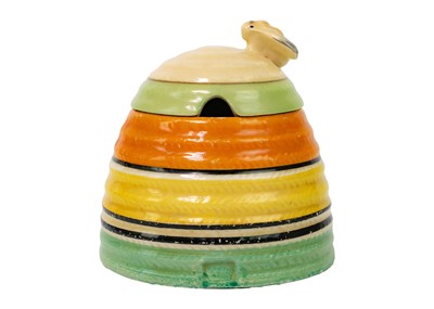 Lot 374 - A Clarice Cliff banded beehive honey pot and cover.