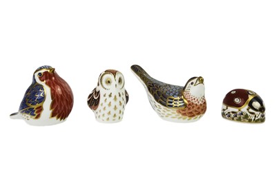 Lot 423 - Four Royal Crown Derby paperweights.