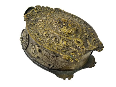 Lot 256 - A cast brass Russian powder flask and cover.