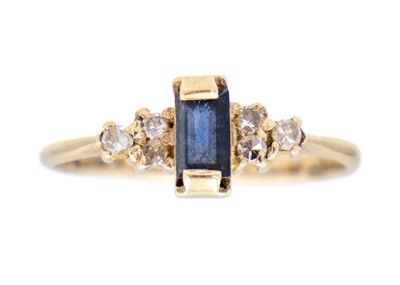 Lot 128 - A modern 9ct sapphire and diamond set seven stone ring.