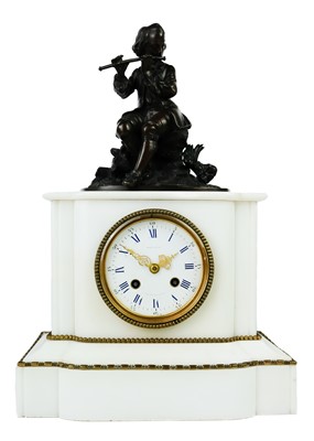 Lot 234 - A French Regence style white marble and bronze mantel clock.