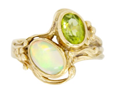 Lot 141 - A 9ct Art Nouveau style opal and peridot set dress ring.