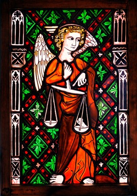 Lot 1176 - A stained glass panel of St Michael weighing the souls.