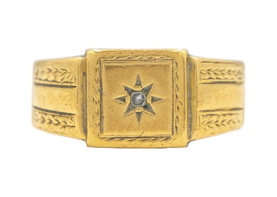 Lot 145 - A heavy 18ct gentleman's signet ring star set with a small diamond.