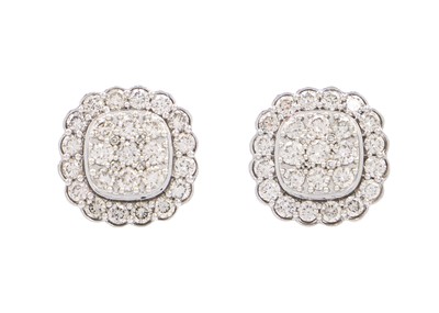 Lot 147 - A pair of 14ct white gold rounded square diamond cluster stud earrings.