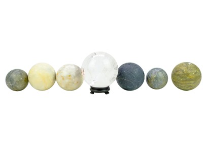 Lot 142 - A collection of seven large sphere shaped minerals.