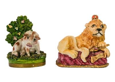 Lot 144 - A reproduction Staffordshire figure of a lion couchant.