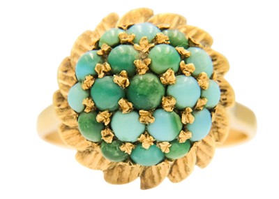 Lot 180 - An 18ct turquoise set dress ring.