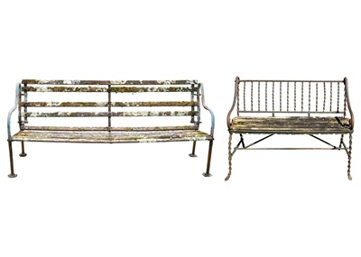 Lot 542 - A cast metal and slatted wood garden bench, and a wrought metal and slatted wood bench.