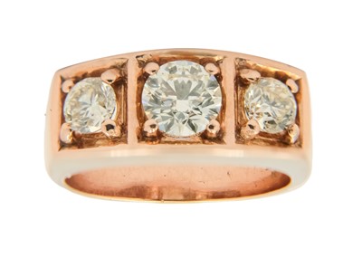 Lot 173 - A modern 9ct rose gold gentleman's diamond set three-stone ring.