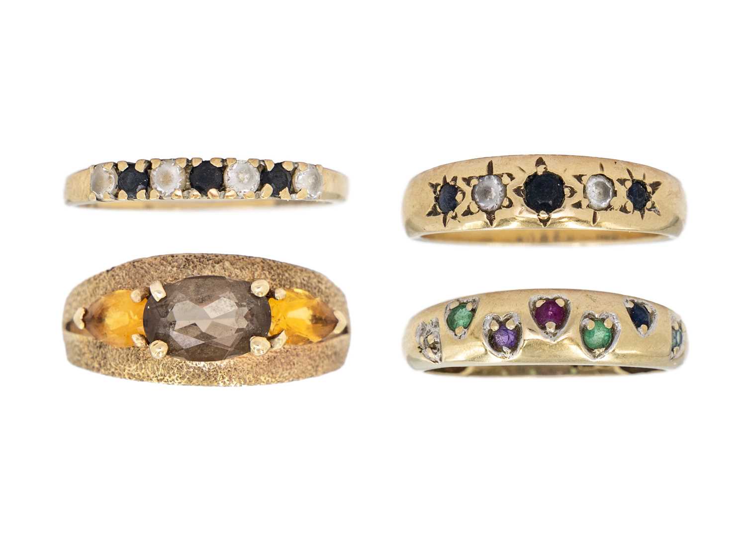 Lot 184 - A selection of four 9ct gem set rings.