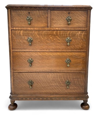 Lot 1230 - An oak chest of drawers.