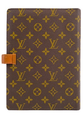 Lot 323 - LOUIS VUITTON - A monogram ring agenda or organiser retailed by Saks Fifth Avenue.