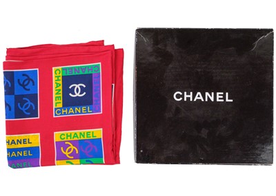 Lot 319 - CHANEL - A silk logo printed scarf.