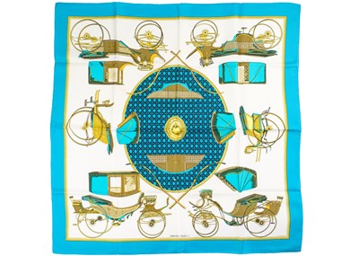 Lot 330 - HERMES - A silk scarf in 'Les voitures a transformation' pattern designed by La Perriere.