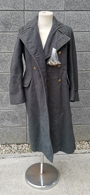 Lot 9 - An RAF Great Coat, dated 1952. The coat is in...