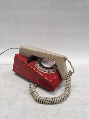 Lot 22 - A vintage rotary Trimphone, painted red and in...