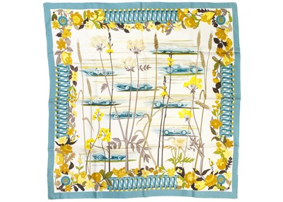 Lot 320 - HERMES - A printed silk scarf 'Les Bolides'.