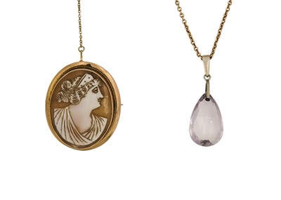 Lot 210 - A 9ct mounted shell cameo brooch and an amethyst pendant on 9ct chain.