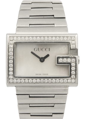 Lot 347 - A Gucci lady's stainless steel diamond set quartz bracelet wristwatch.