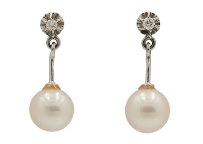 Lot 218 - A pair of 18ct white gold diamond set cultured pearl drop stud earrings.