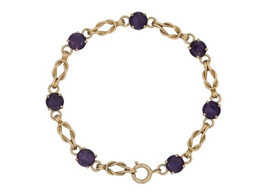 Lot 233 - A 9ct amethyst set twist link design bracelet.