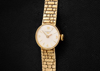 Lot 100 - LONGINES - A 9ct lady's manual wind bracelet wristwatch.