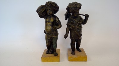 Lot 4 - Two bronze harvest cherubs on marble bases,...