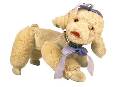 Lot 309 - A soft articulated and wind-up musical poodle soft toy pyjama case.