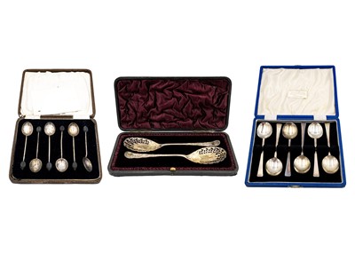 Lot 77 - A selection of three silver cased spoon sets.