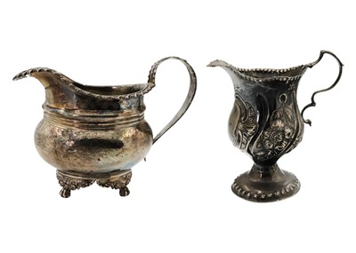 Lot 87 - A George IV silver milk jug and a Georgian silver cream jug.