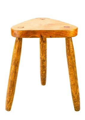 Lot 312 - A St Ives oak three-legged stool.