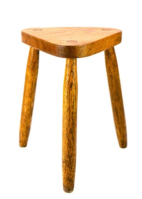 Lot 312 - A St Ives oak three-legged stool.