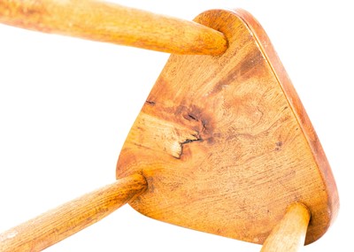 Lot 312 - A St Ives oak three-legged stool.