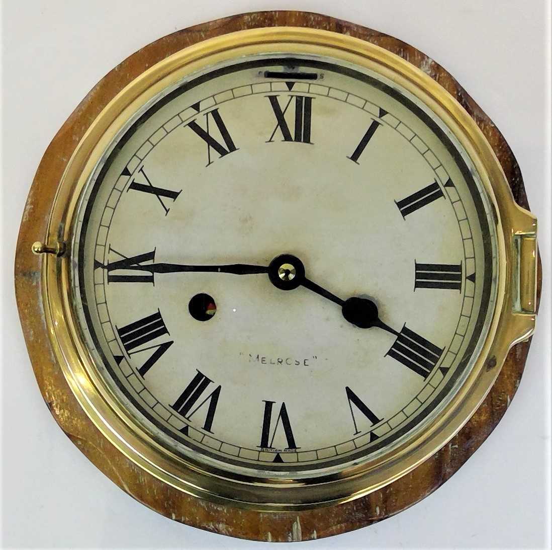 Lot 3304 A brass wall clock, of bulkhead style,