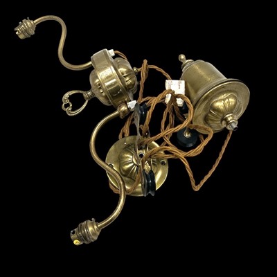 Lot 81 - A rise and fall ceiling light in brass.