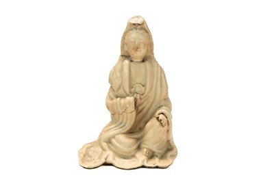 Lot 1492 - A Chinese pottery figure of seated Guanyin.