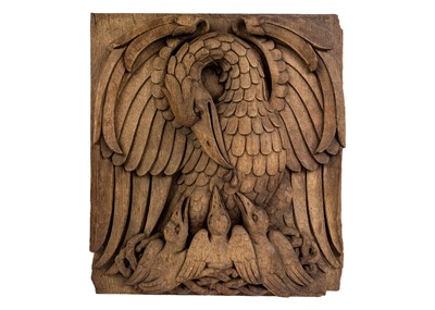 Lot 1050 - An ecclesiastical oak relief carved panel of Pie Pellicáne.