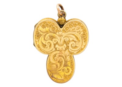 Lot 1 - A Victorian gold front and back foliate engraved triform locket pendant.